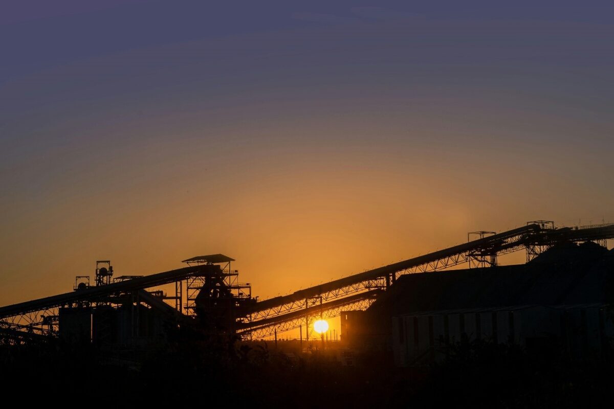 Aggregate plant conveyor at sunset — Aggregate Consulting LLC
